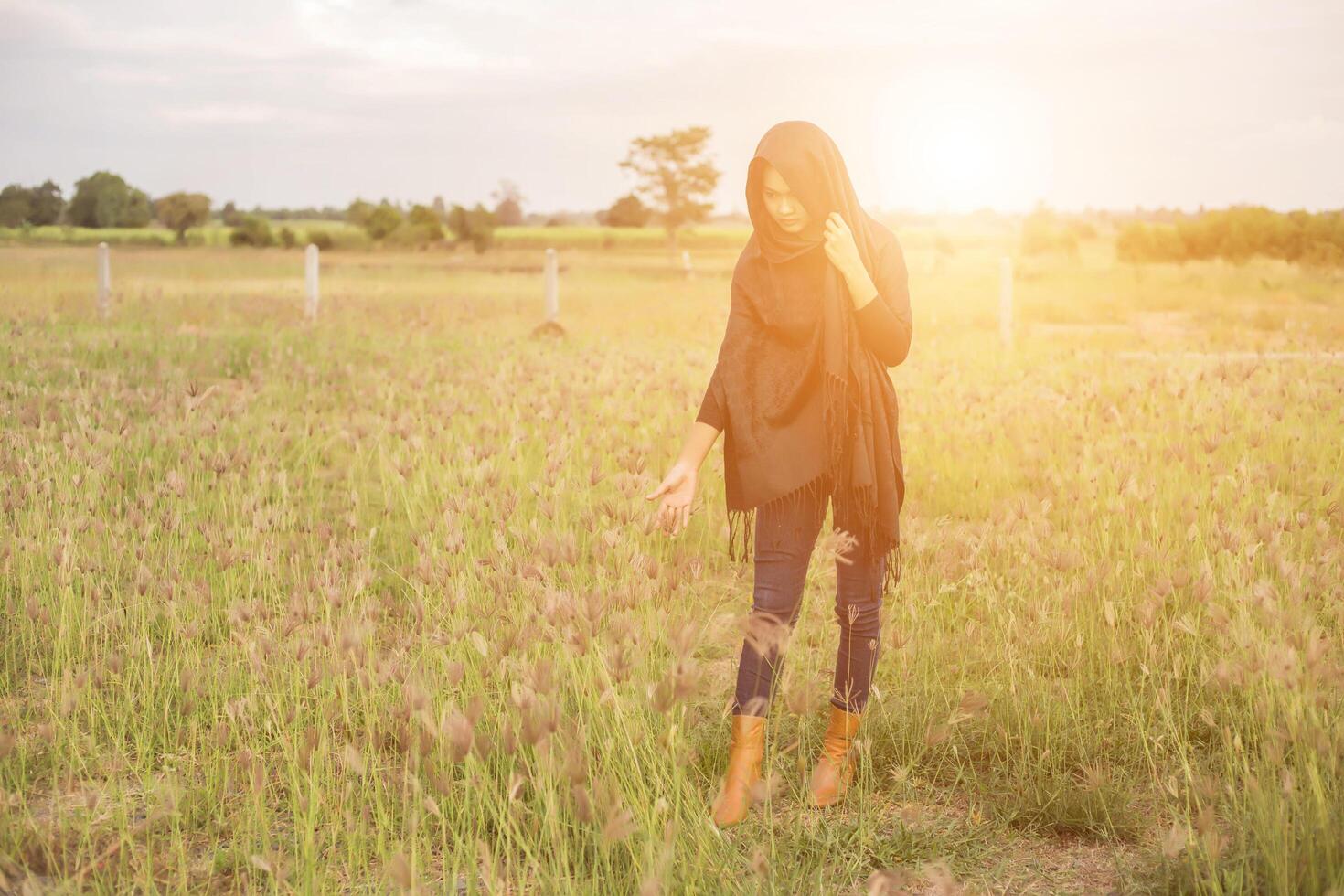 Silhouette of woman praying over beautiful sky background photo