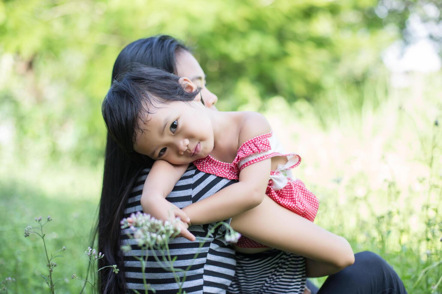 Mother holding her daughter photo