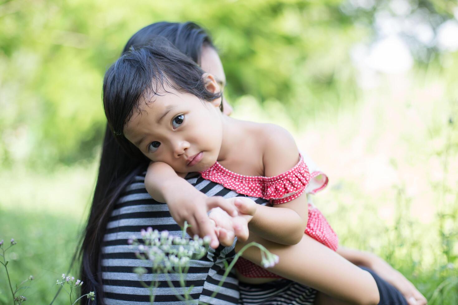 Mother holding her daughter photo
