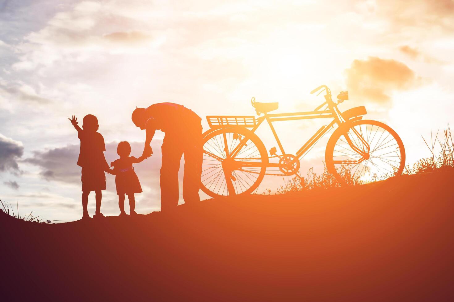 Biker family silhouette father and son photo