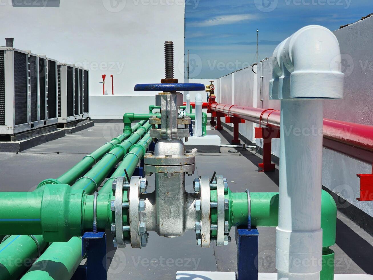 Water pipes and water tanks on the building photo
