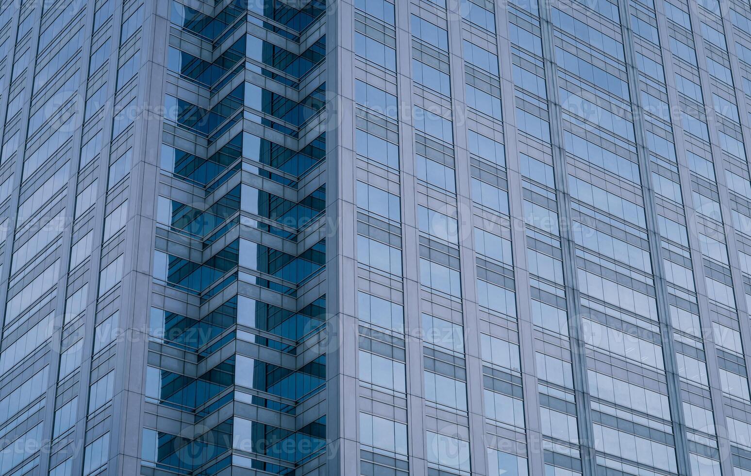 Skyscraper glass building of corporate headquarters in the downtown business area. Towering facade and windows embodying sleek, modern office environment. Financial institution. Modern architecture. photo