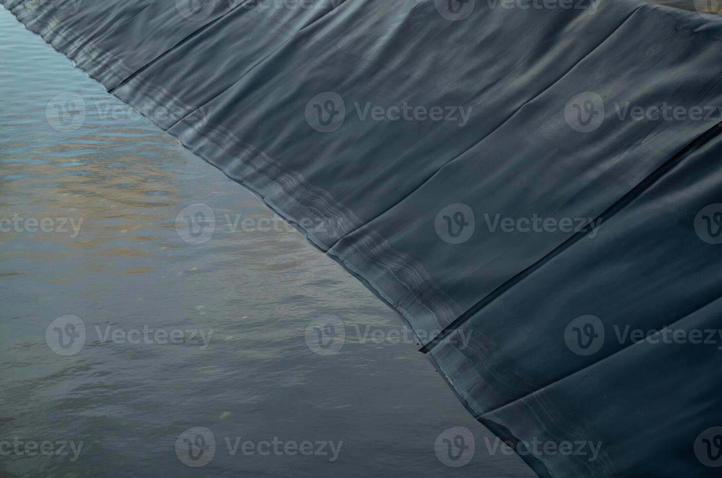 Aquaculture farming pond liner system. HDPE geomembrane technology. Water containment and environmental protection in sustainable fish farming. High-density polyethylene transforms aquaculture ponds. photo