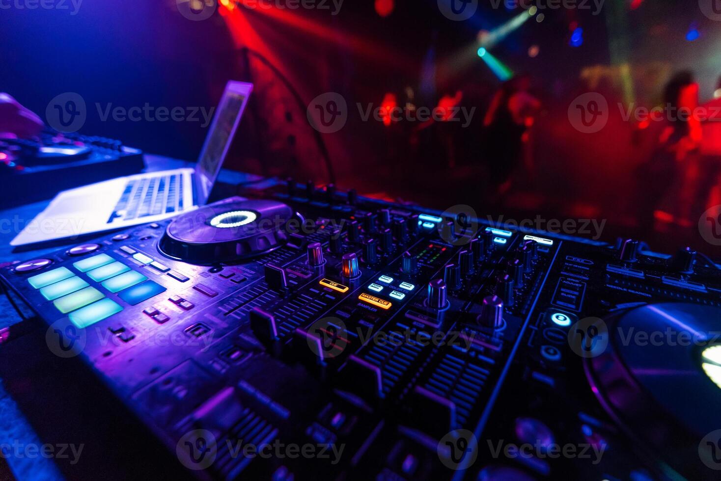 DJ mixer controller Board for mixing music in a nightclub photo