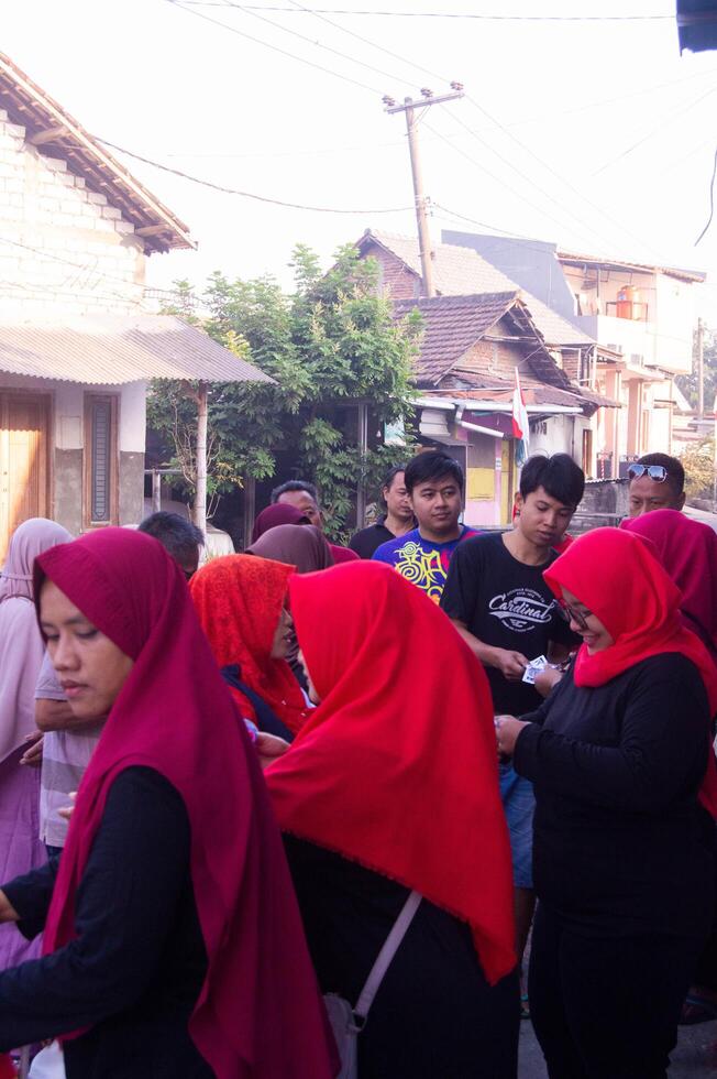Gresik, Indonesia, 20 August 2023 - Portrait of residents going on a healthy walk together in a village photo
