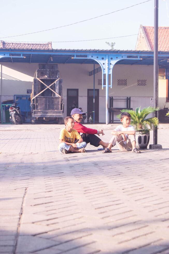 Gresik, Indonesia, 20 February 2024 - shot on Indonesian boy's expression. candid photo. photo