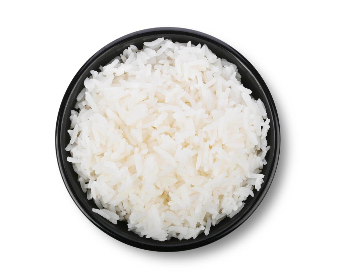 Rice in black bowl isolated on white background photo