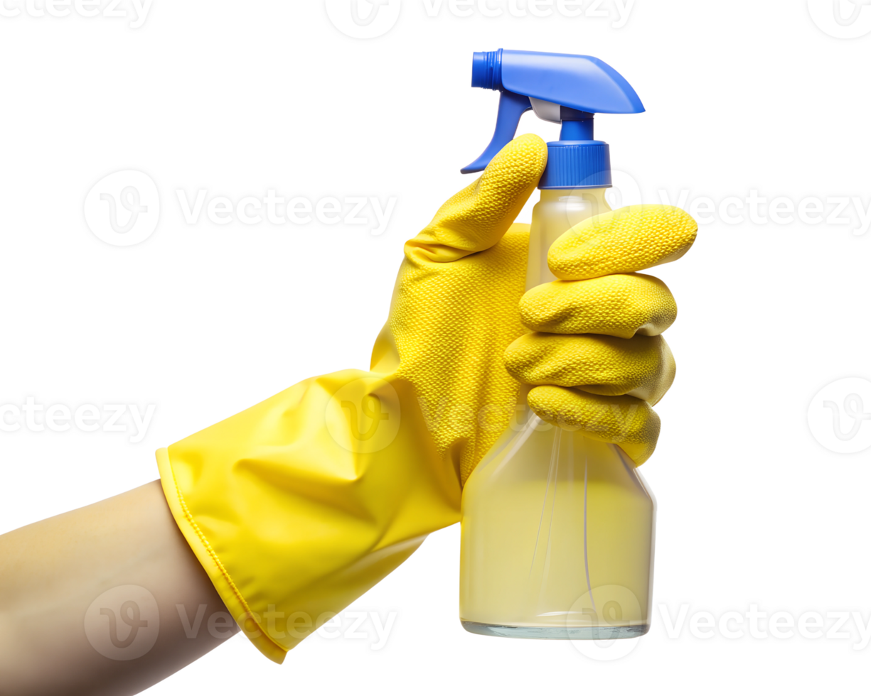 A person wearing yellow gloves holds a spray bottle filled with cleaning solution in a bright, well-lit space, transparent png