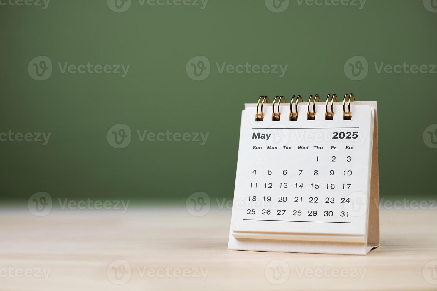 Calendar page May of the year 2025 white color on green background. with copy space and business design. concept of planning and setting new strategic goals. photo
