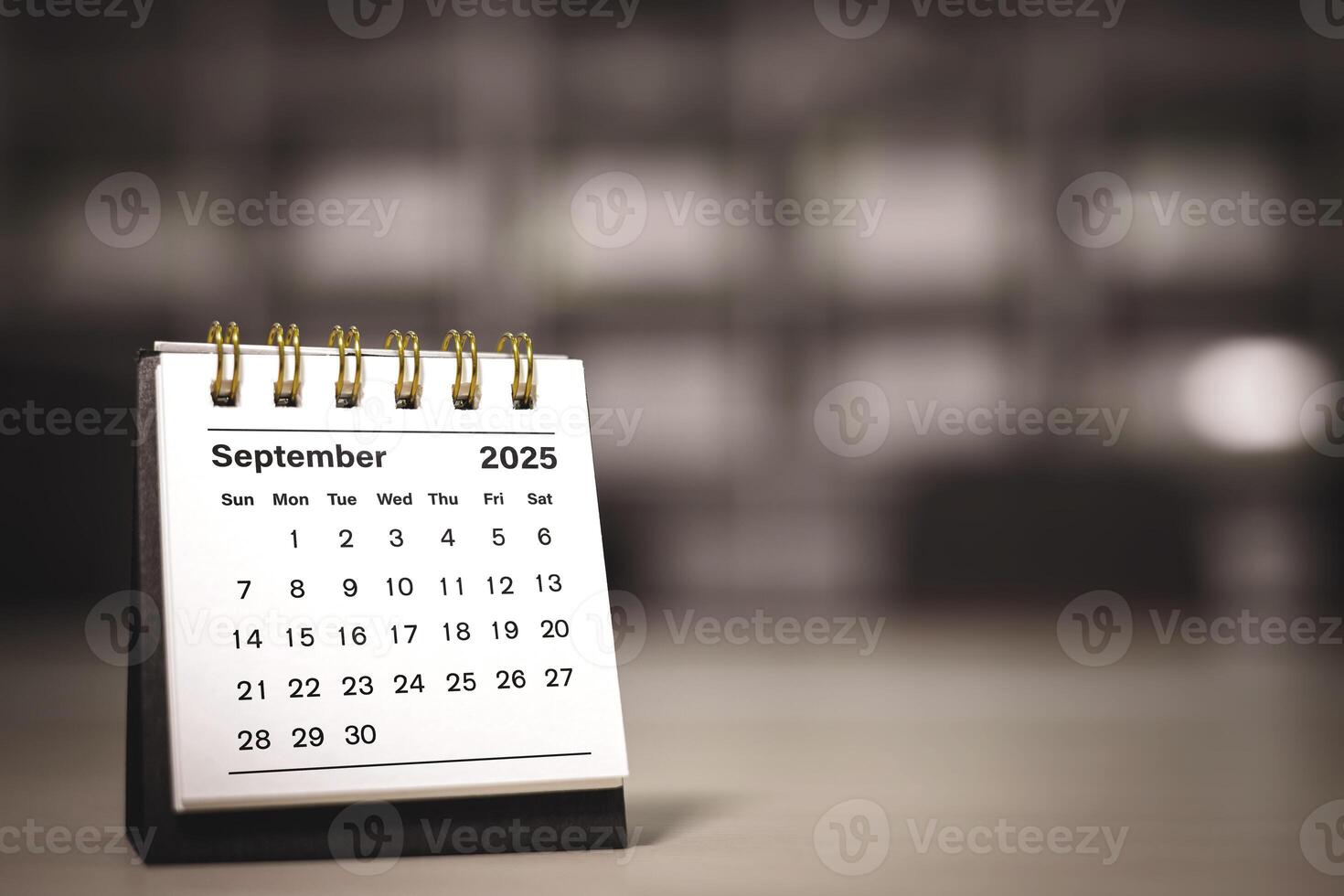 Calendar page September of the year 2025 white color in meeting room in office. with copy space and business design. concept of planning and setting new strategic goals. photo