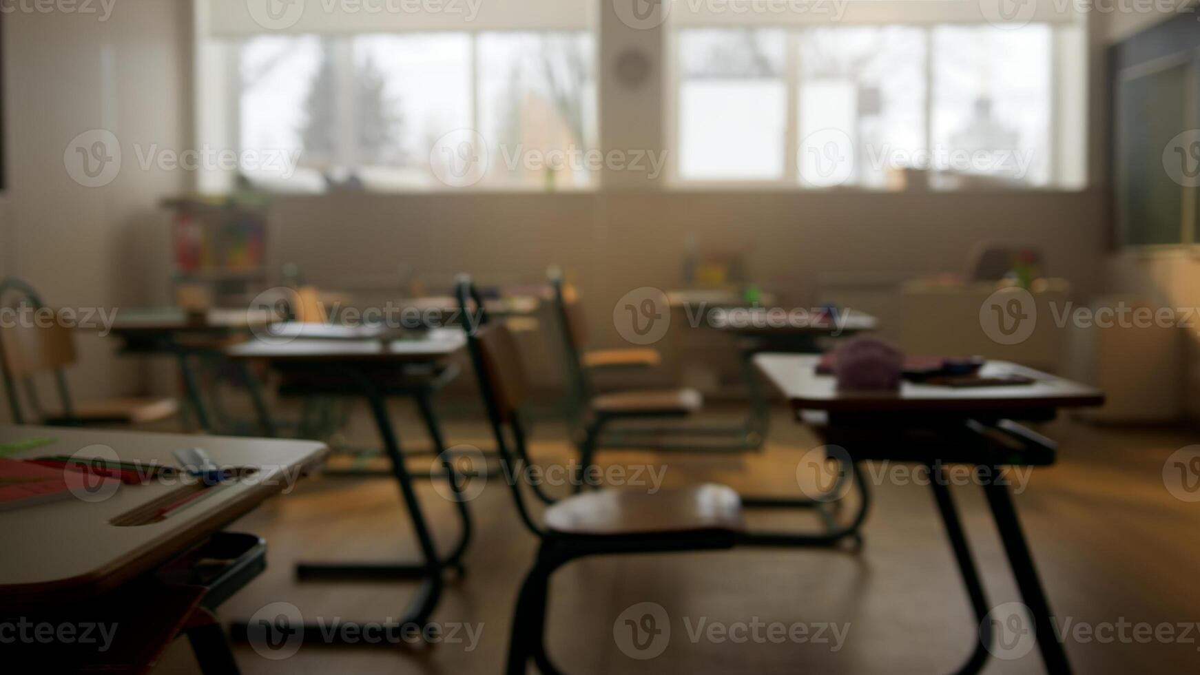 Empty classroom with desks, chairs and chalkboard. photo