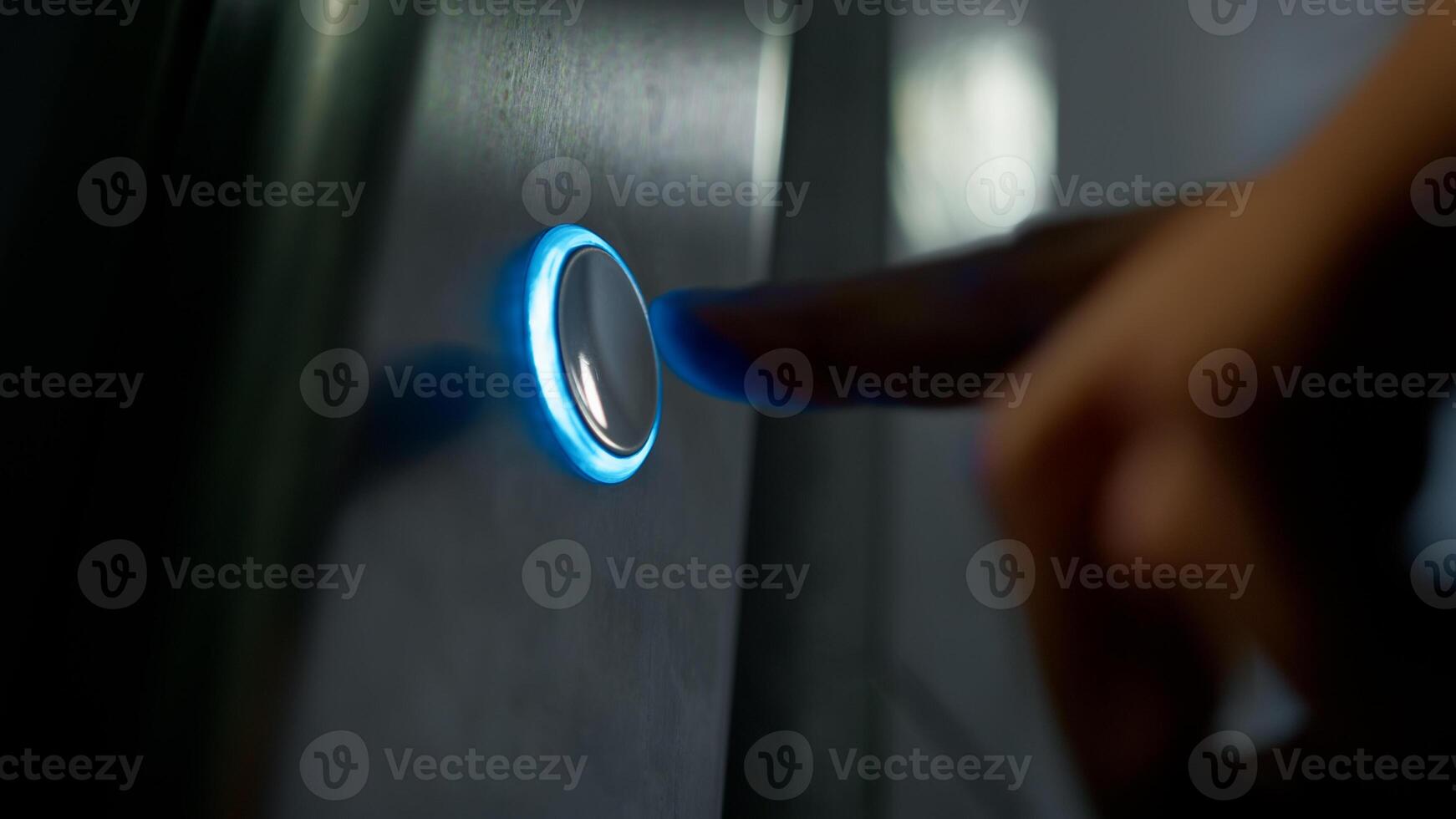 Finger Of Man Pressing Button For Call The Elevator In The Palace photo