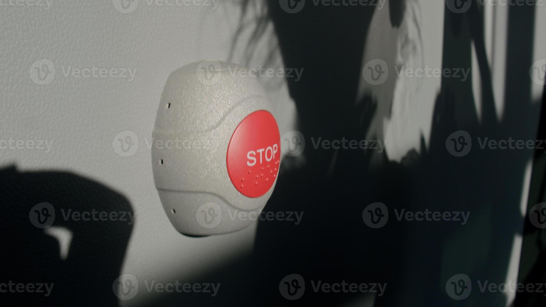 Stop Button and the Hand of Worker About to Press it. emergency stop button. Big Red emergency button or stop button for manual pressing. photo