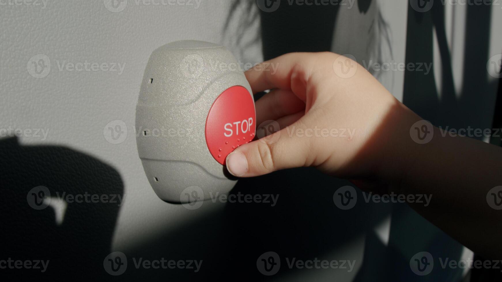 Stop Button and the Hand of Worker About to Press it. emergency stop button. Big Red emergency button or stop button for manual pressing. photo