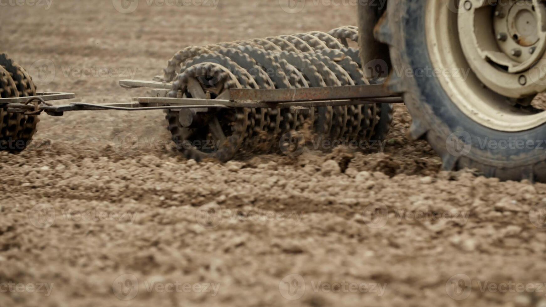 Track shoe of the excavator with soil in the background. photo