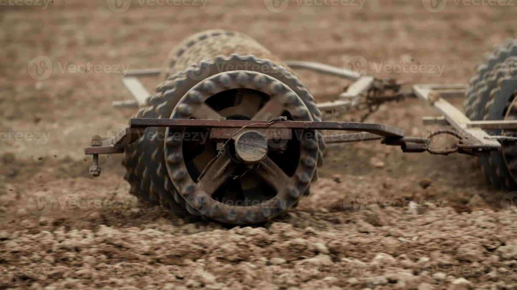 Track shoe of the excavator with soil in the background. photo