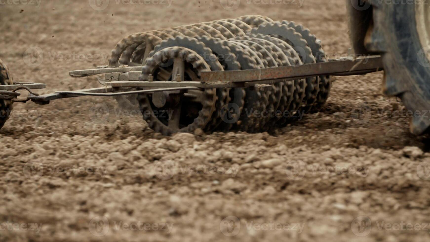 Track shoe of the excavator with soil in the background. photo