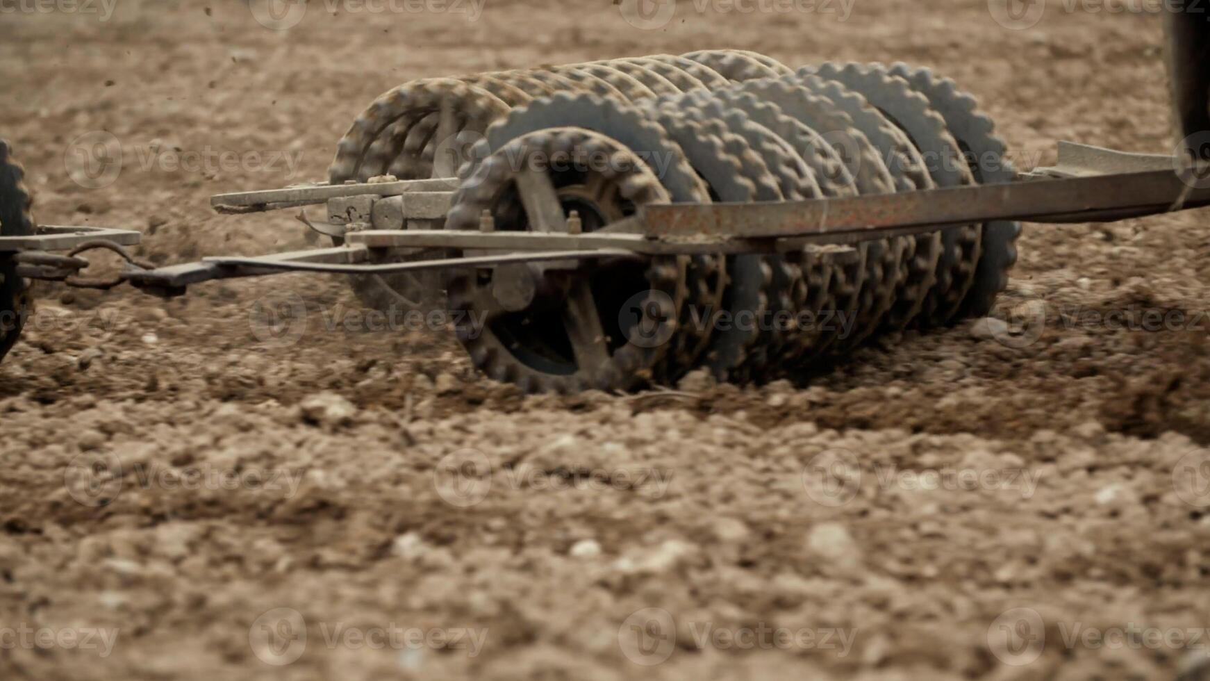 Track shoe of the excavator with soil in the background. photo
