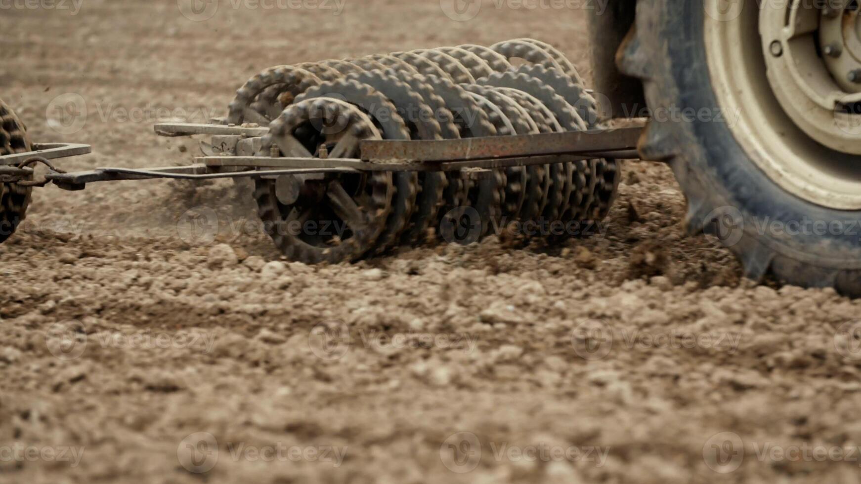 Track shoe of the excavator with soil in the background. photo