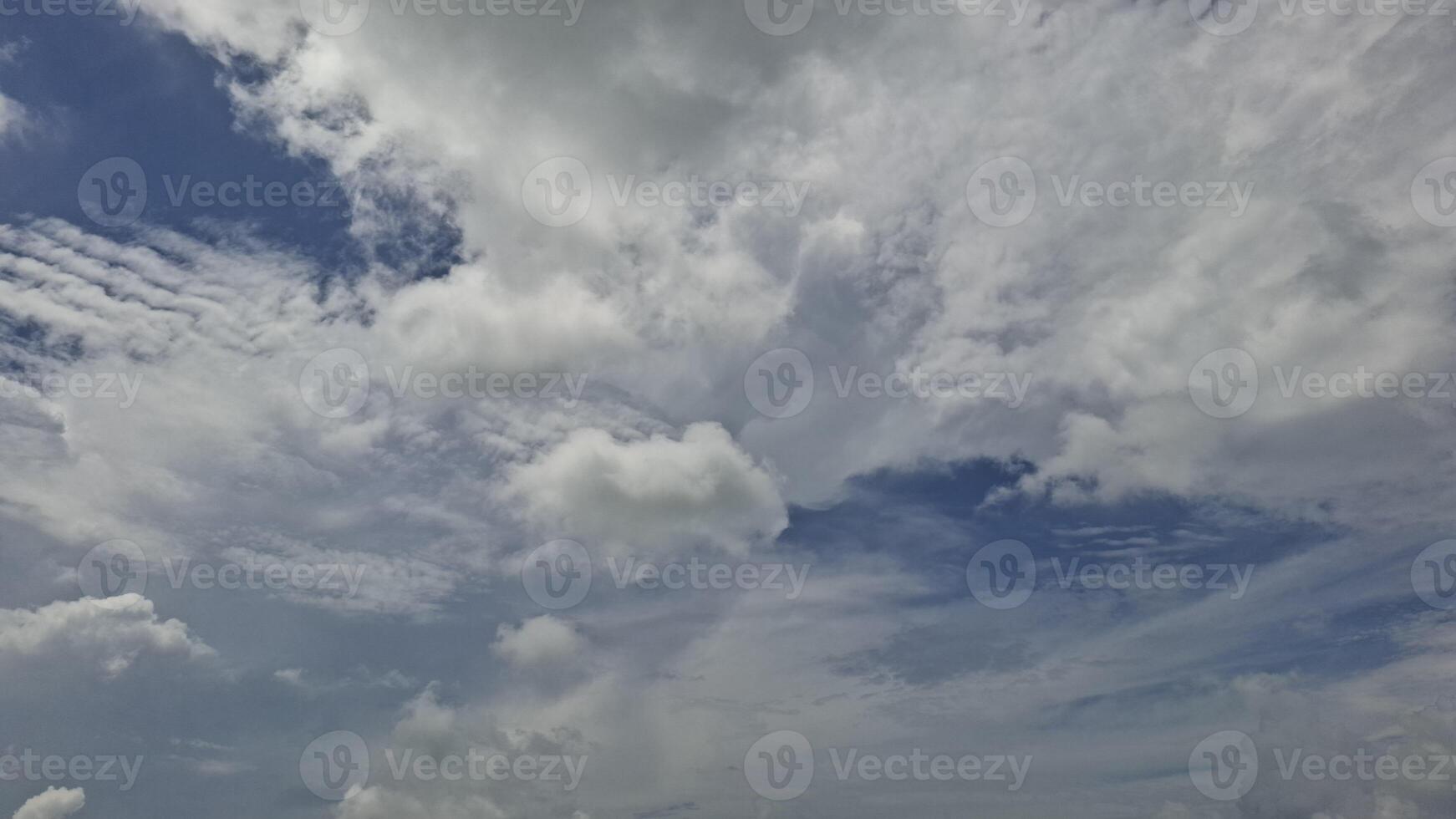 White Fluffy Clouds Against Blue Sky photo