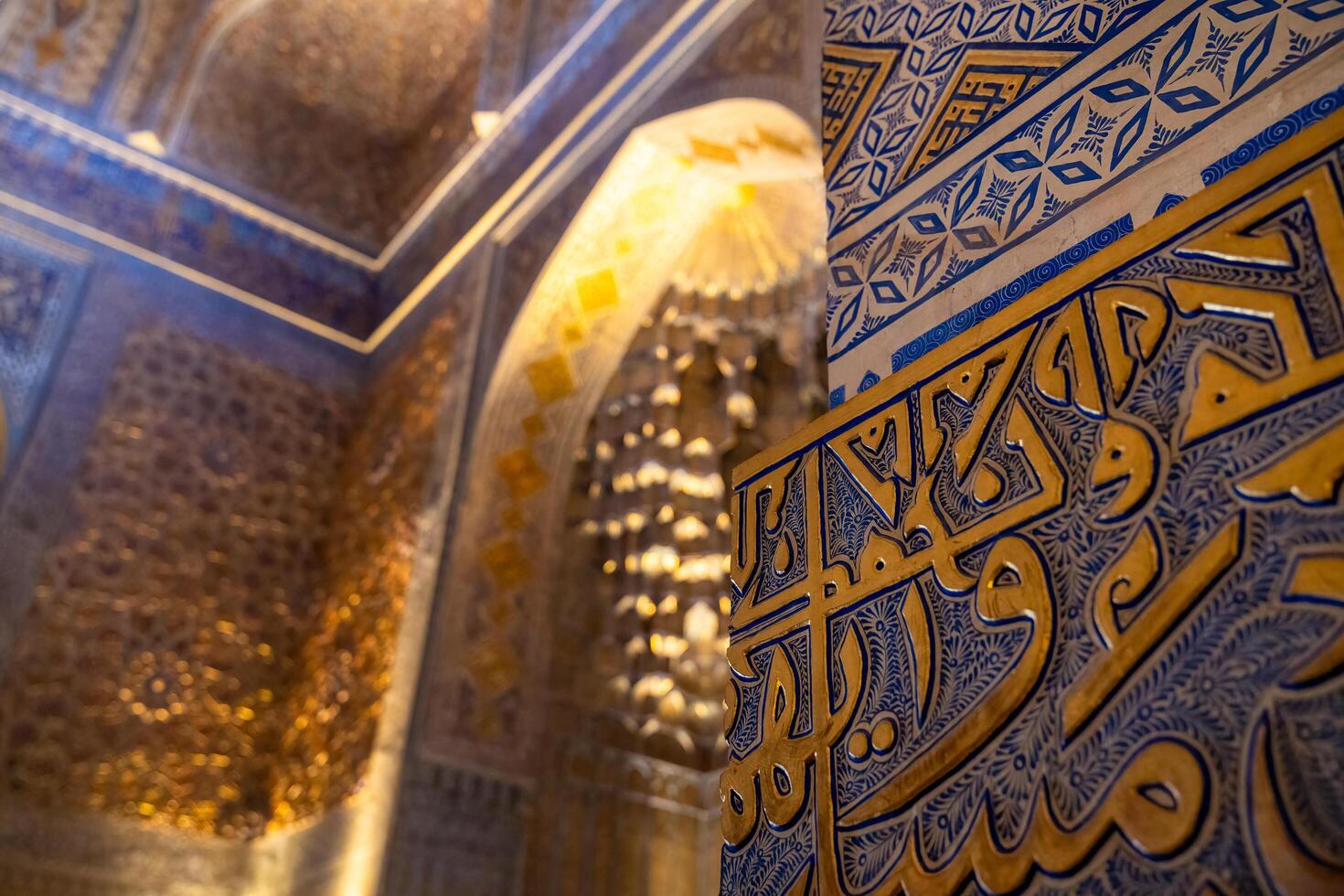 Tashkent, Uzbekistan-august 12, 2023-view of the beautiful decorated interior of the Tamerlane Mausoleum with decorated tombs, mosaics and carvings during a day photo