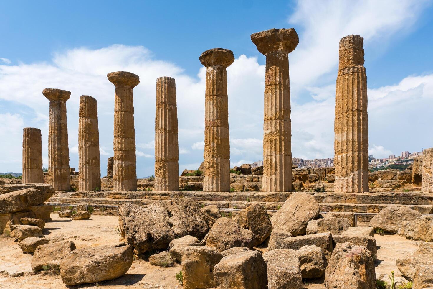 Agrigento, Italy-May 10, 2022-view of the columns oh the Temple of Hercules inside the valley of the temples, an archaeological park near Agrigento during a sunny day photo