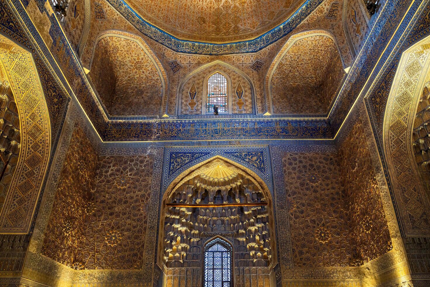 Tashkent, Uzbekistan-august 12, 2023-view of the beautiful decorated interior of the Tamerlane Mausoleum with decorated tombs, mosaics and carvings during a day photo