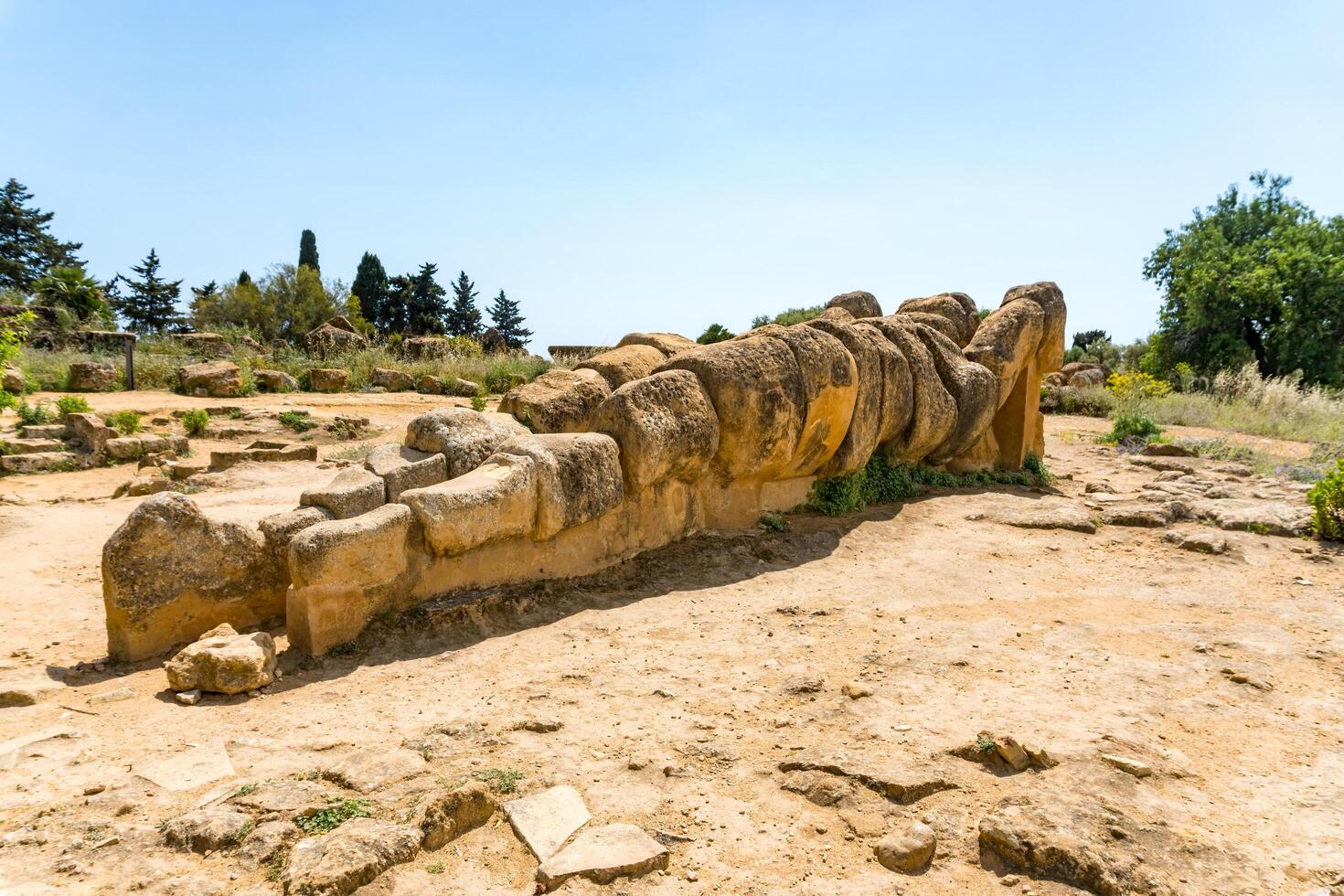 Agrigento, Italy-May 10, 2022-view of the Telamon inside the valley of the temples, an archaeological park near Agrigento during a sunny day photo