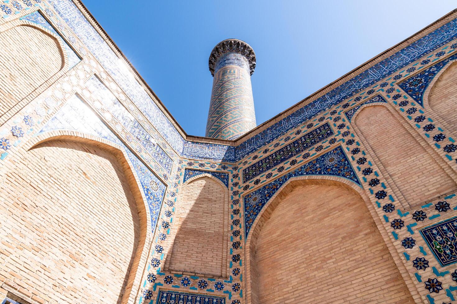 Tashkent, Uzbekistan-august 12, 2023-particular of the Tamerlane Mausoleum with decorated tombs, mosaics and carvings during a sunny day photo