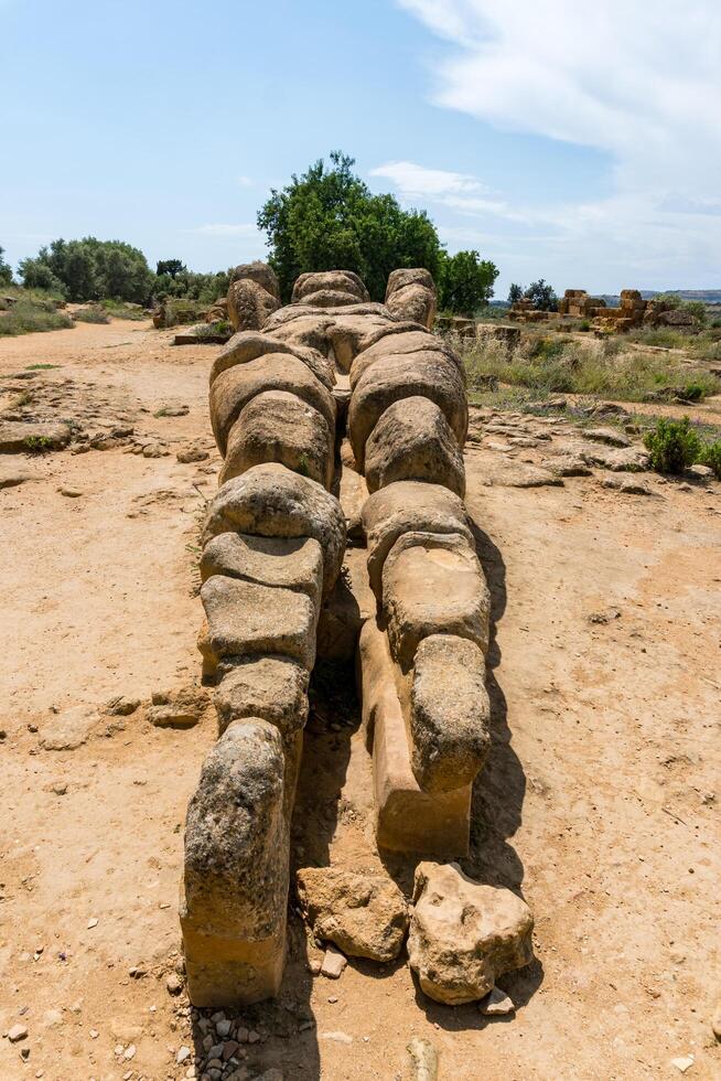 Agrigento, Italy-May 10, 2022-view of the Telamon inside the valley of the temples, an archaeological park near Agrigento during a sunny day photo