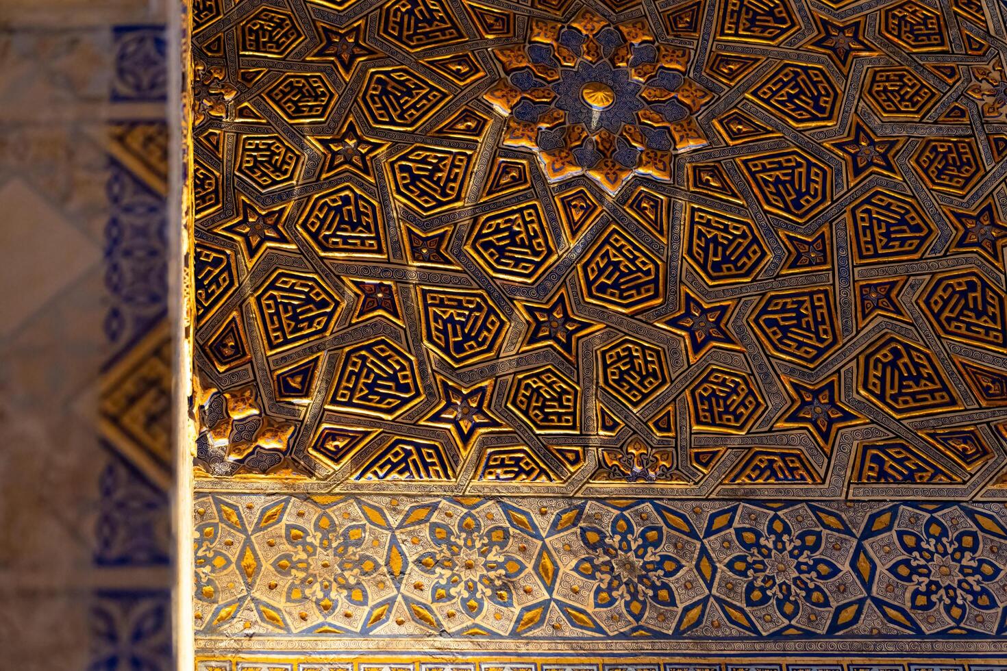 Tashkent, Uzbekistan-august 12, 2023-view of the beautiful decorated interior of the Tamerlane Mausoleum with decorated tombs, mosaics and carvings during a day photo
