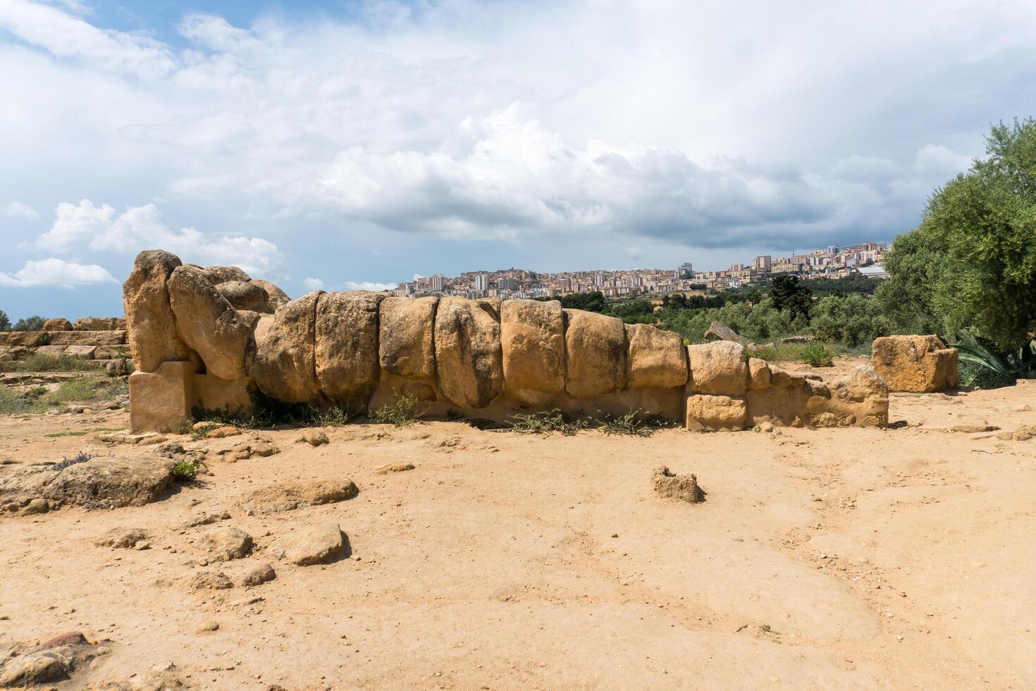 Agrigento, Italy-May 10, 2022-view of the Telamon inside the valley of the temples, an archaeological park near Agrigento during a sunny day photo