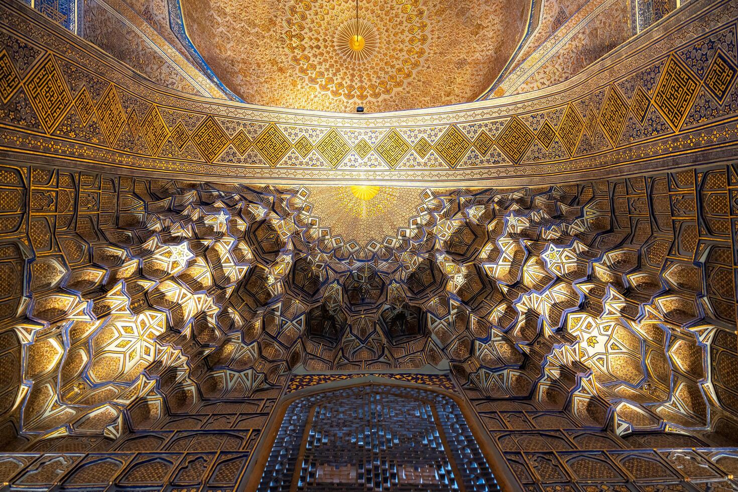 Tashkent, Uzbekistan-august 12, 2023-view of the beautiful decorated interior of the Tamerlane Mausoleum with decorated tombs, mosaics and carvings during a day photo