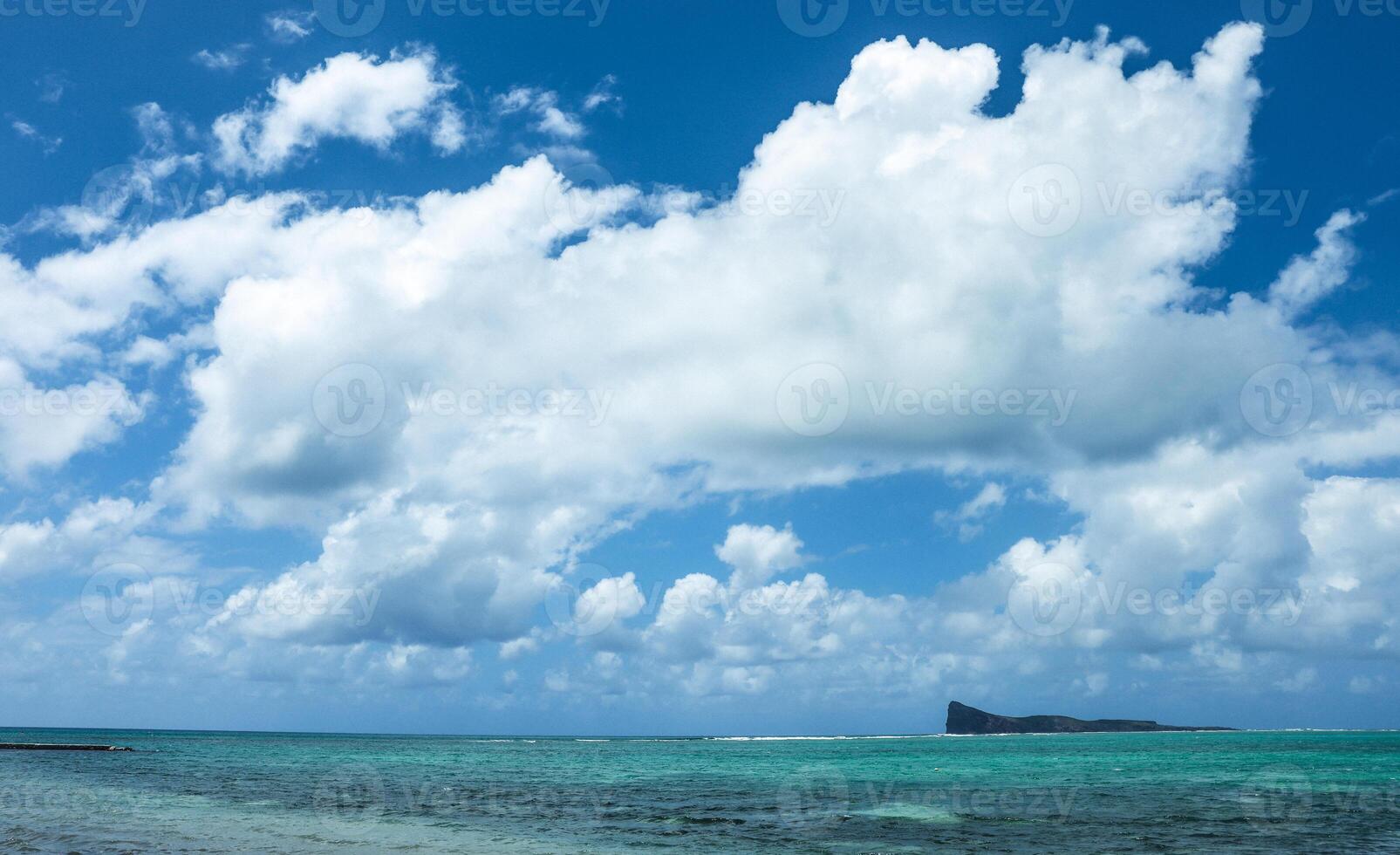 Port Louis, Mauritius - January 12, 2023 - Aerial view of a group of boats floating on the water, creating a fascinating scene in the beautiful landscape of Mauritius. photo