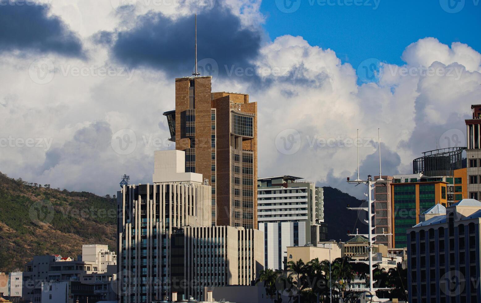 A photograph capturing the view of Port Louis City in Mauritius, showcasing its remarkable skyline filled with numerous towering buildings. photo