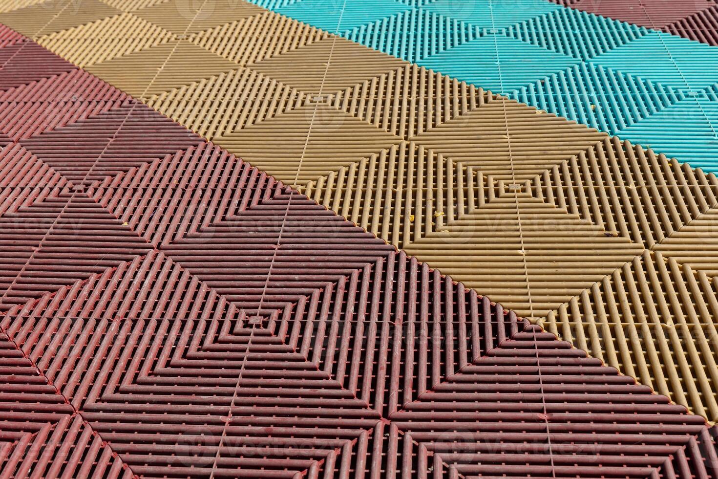 mosaic tile floor with a red brown and blue pattern photo