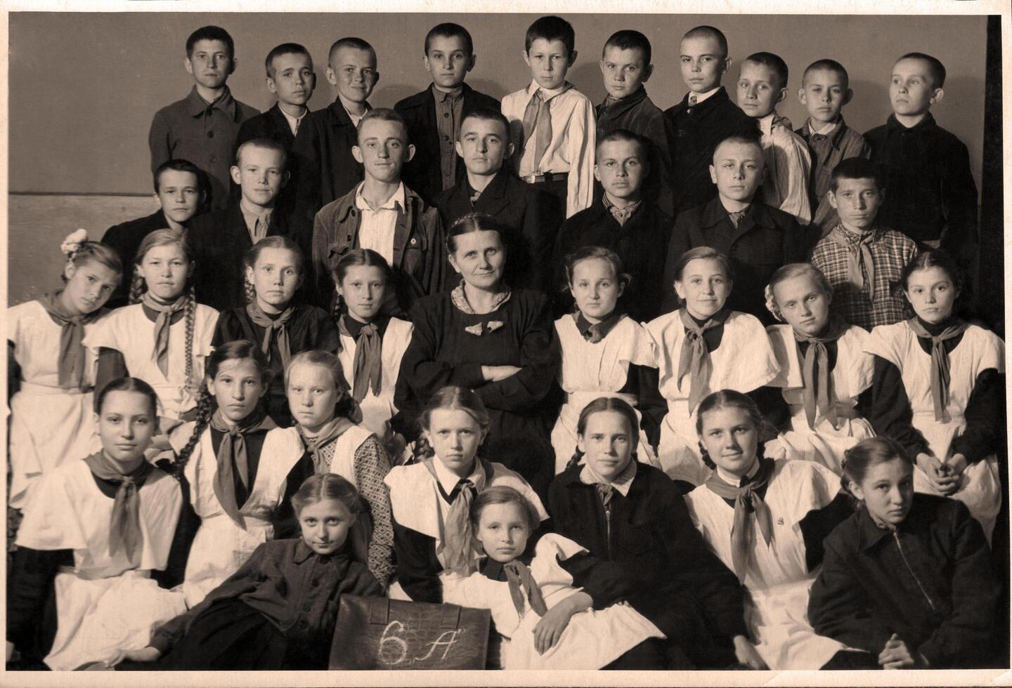 USSR, Ukraine, Novoshakhtinsk - circa 1958 Group portrait of schoolchildren in uniform photo