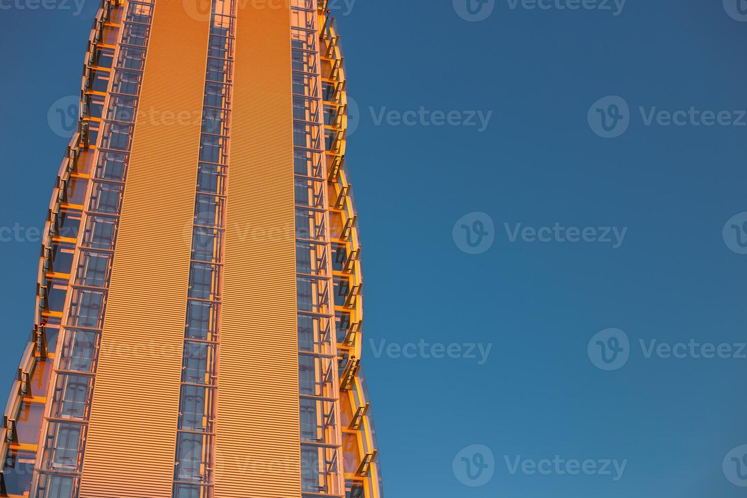 Skyscraper against the blue sky. Place for text. Glass buildings in Milan, Italy. CityLife Shopping District complex - the new commercial and residential area. Finance, economics, future concepts photo