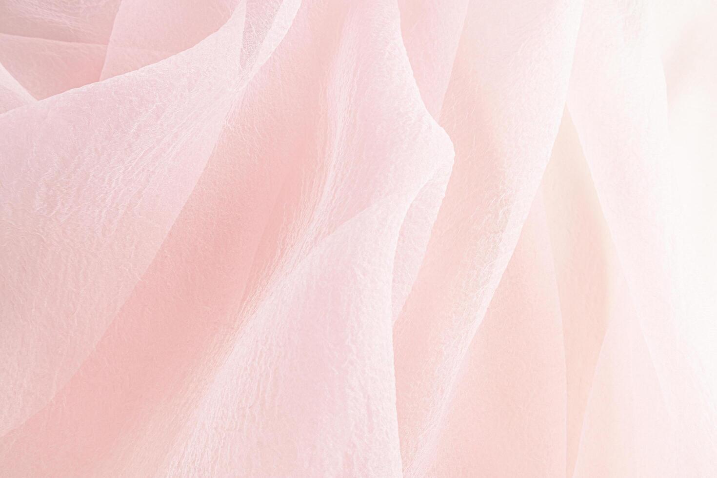 Elegant fabric background for design. Soft delicate chiffon folds of pastel-colored fabric. wedding background. Drapery of silk transparent fabric. photo