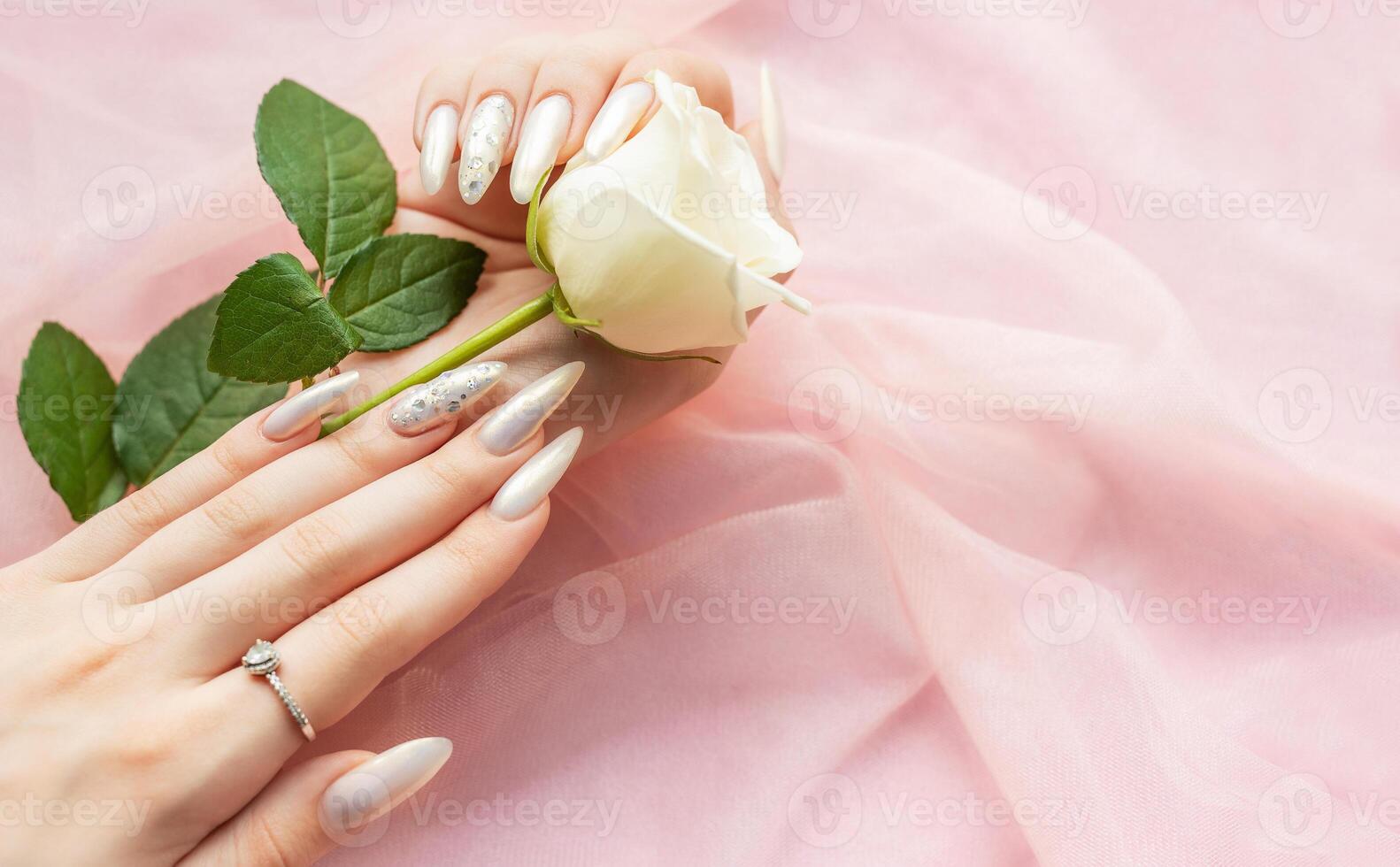 Female Hands with beautiful pearl manicure photo
