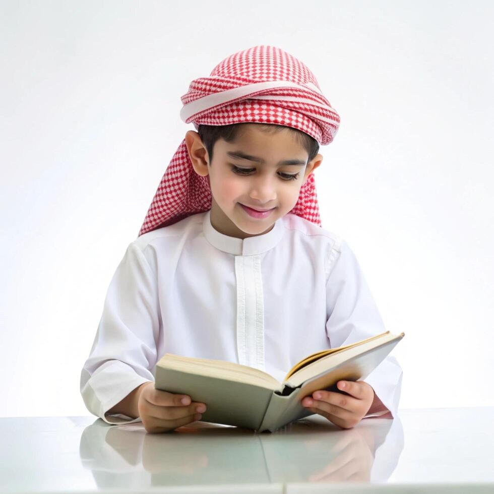 Cute a little boy writing a book on the table with on white background photo