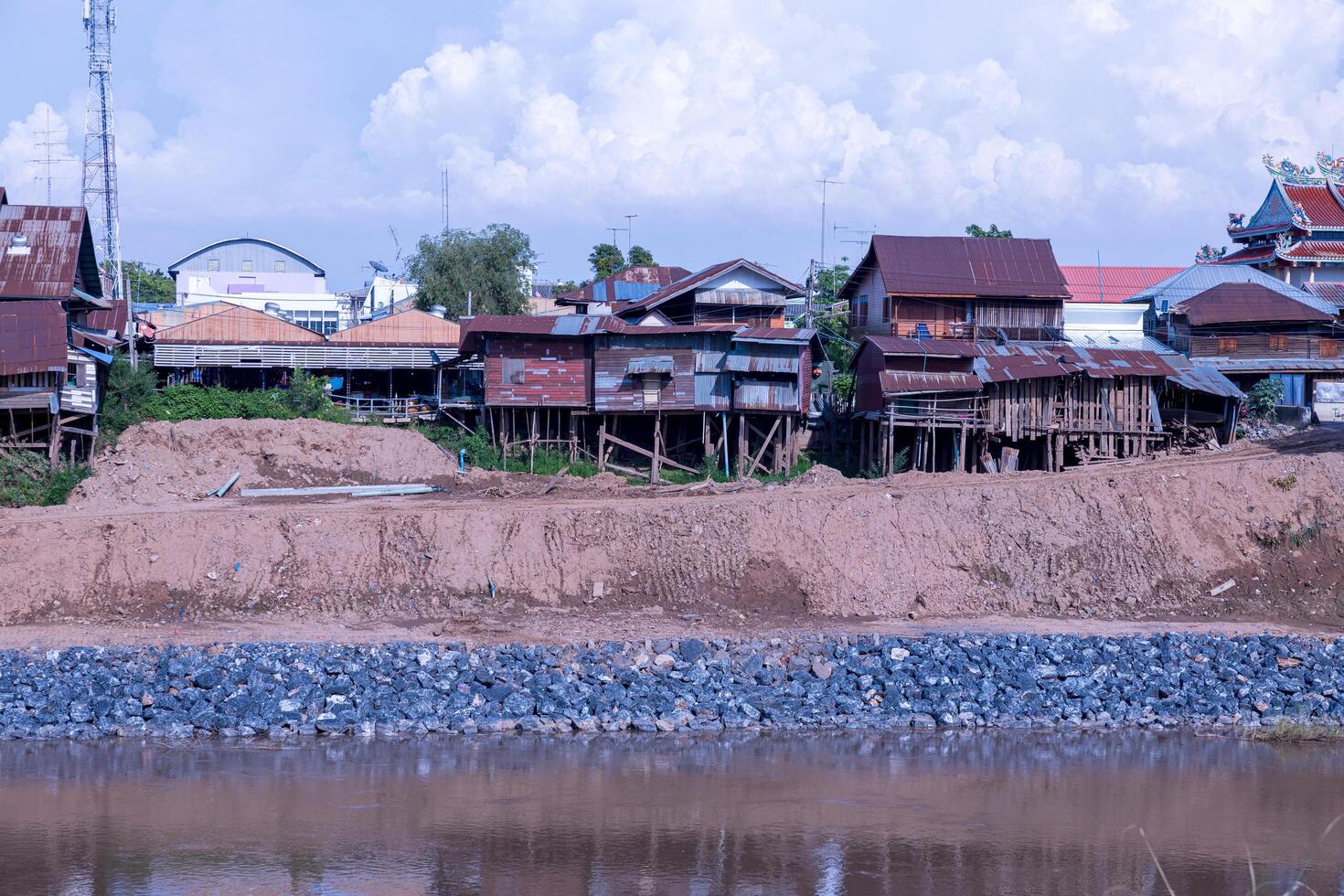 A view of old tin-roofed wooden houses near collapse. photo