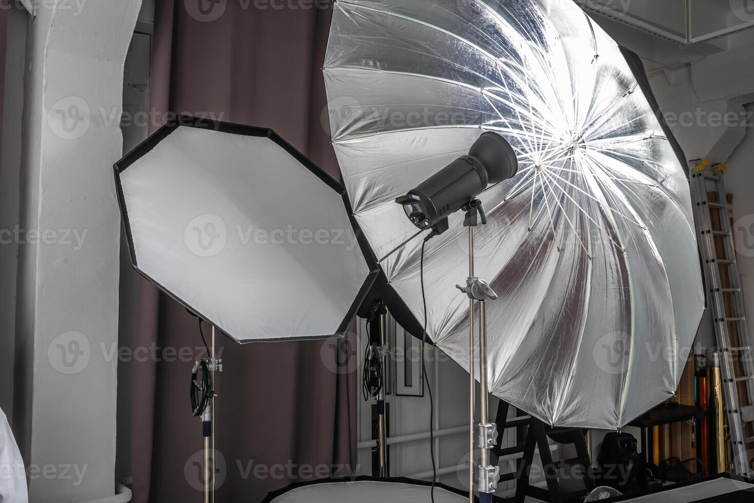 interior of bright space of photo studio with lighting equipment
