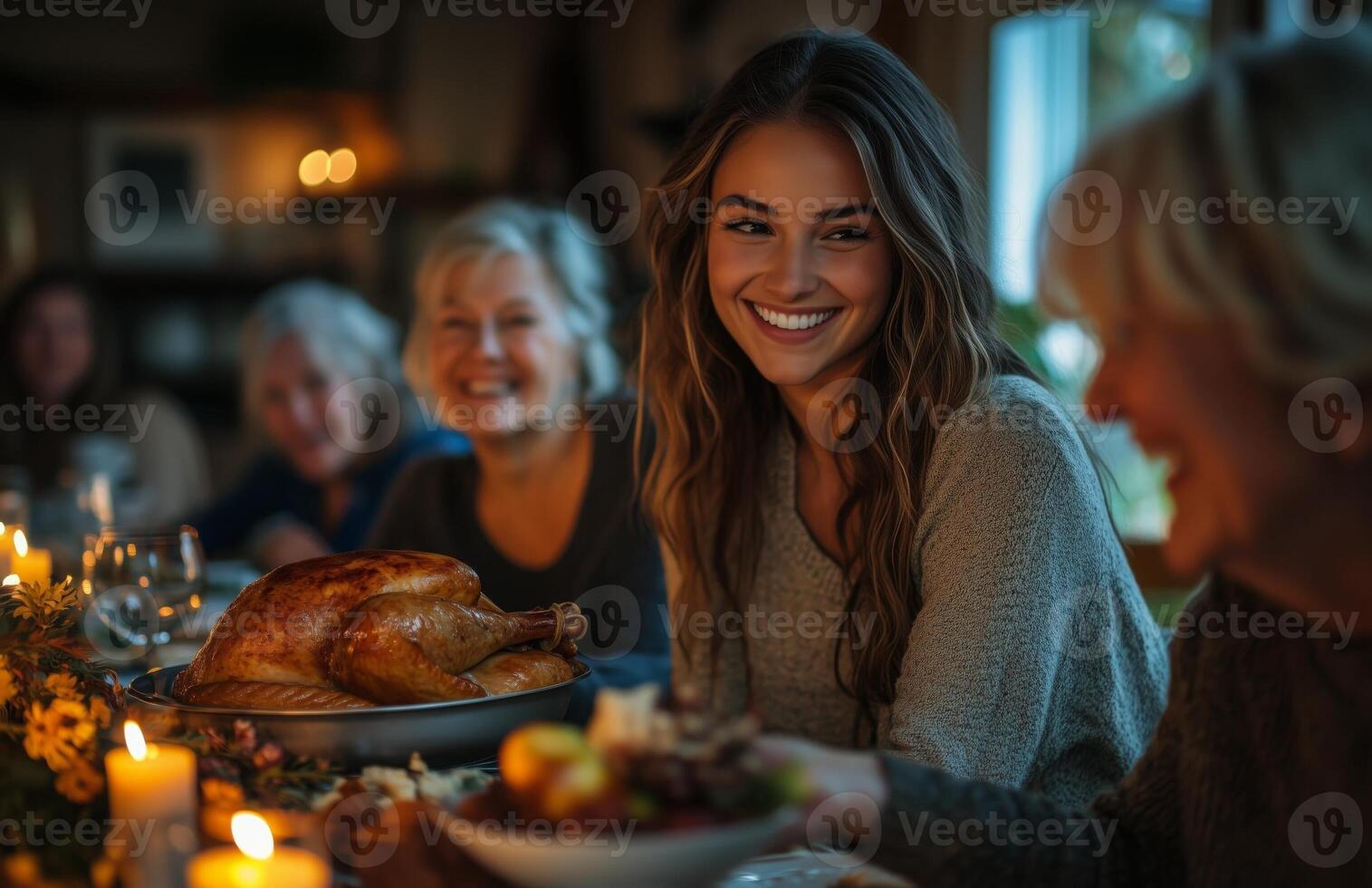Family and friends enjoying Thanksgiving dinner at home, woman serving hot turkey to everyone photo