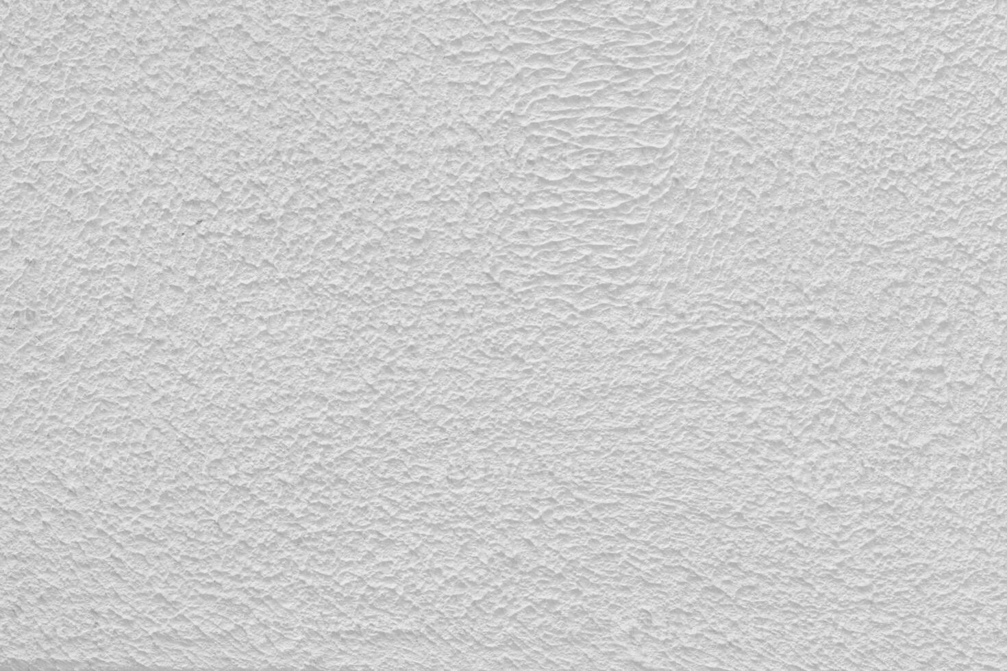 Pink plaster wall of a building. Rough surface texture. photo