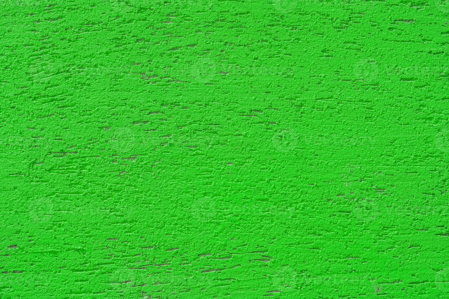 Pink plaster wall of a building. Rough surface texture. photo