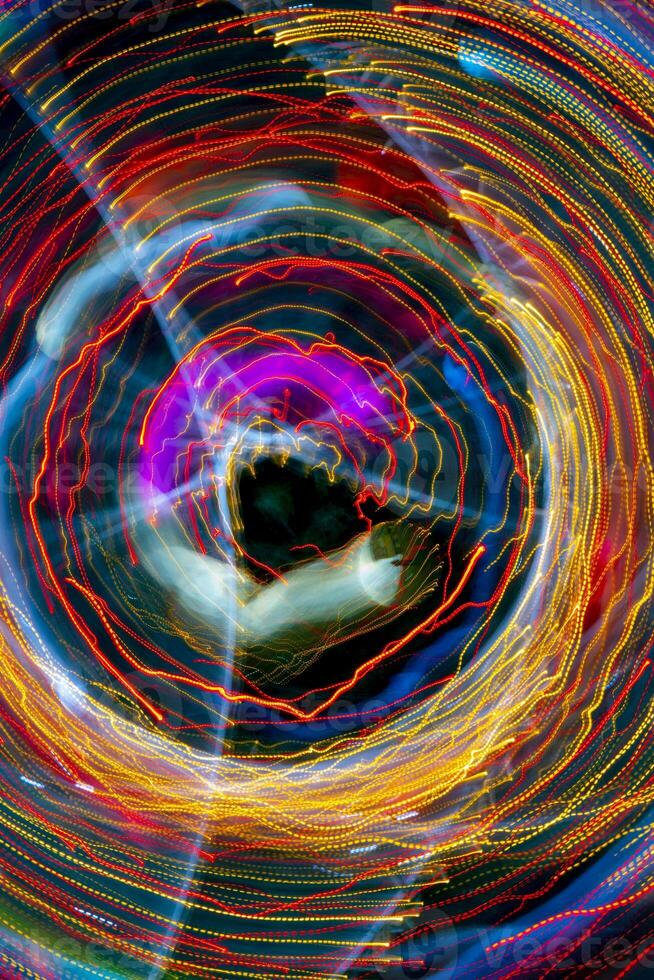 A pattern of glowing lines of light. Abstract design background. photo
