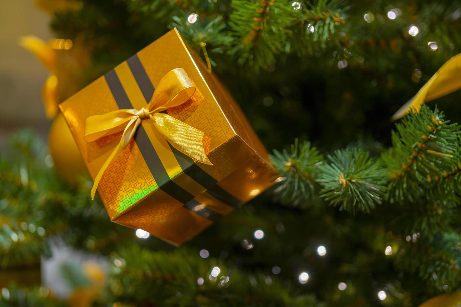 Holiday decorations for the Christmas tree. Blurred holiday background. photo