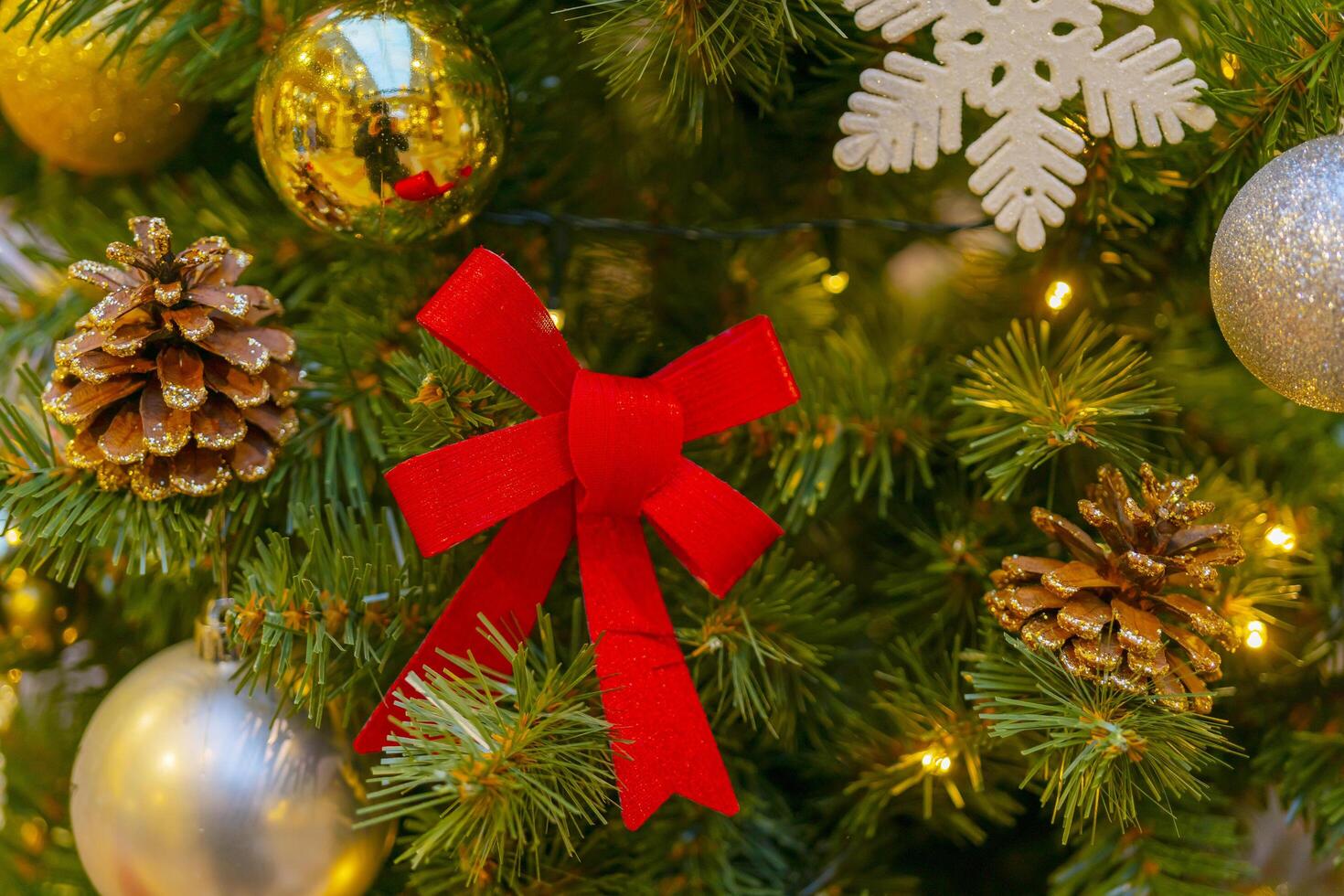 Holiday decorations for the Christmas tree. Blurred holiday background. photo