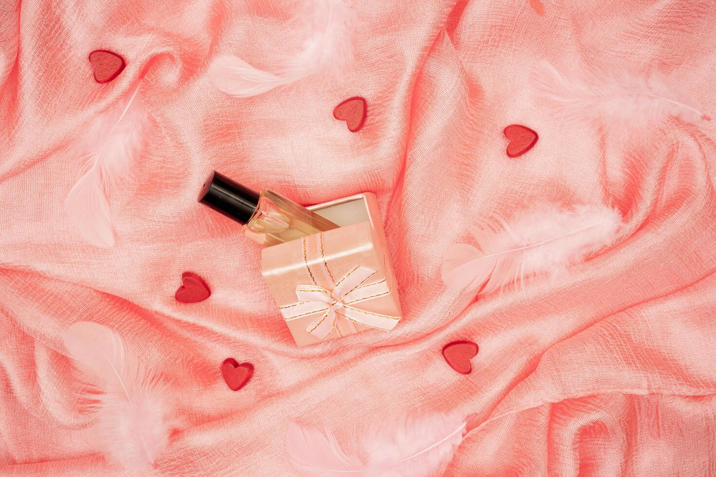 Valentine's day pink background. Folds of silk fabric. photo